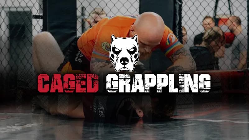 Two grapplers competing inside the cage at a UGI Caged Grappling event