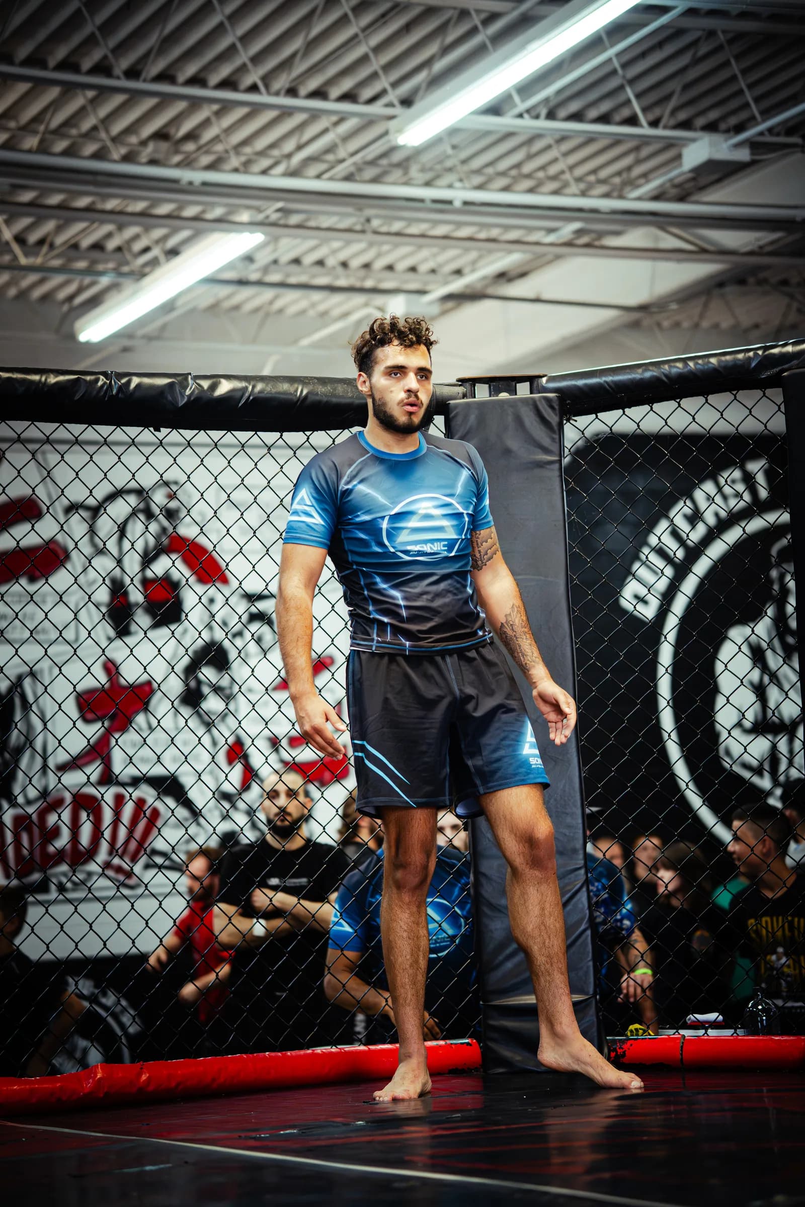 A competitor standing in the cage at UGI 10, Upgrade Industries, June 2026